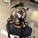 2 braided ponytails