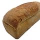 Volkoren busbrood donker: half gesneden